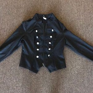 Form fitting black zip up buttoned vest